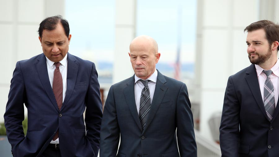 IGI leadership V. Jain, B. Mason and N. Matchett walking together 