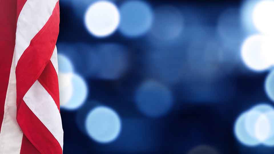 IGI Political Investigations US flag against blue and white bokeh background 